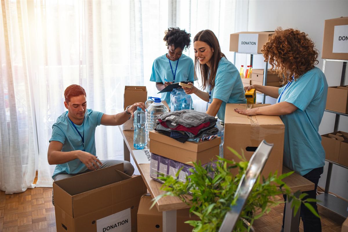 Volunteers packing donated supplies into boxes